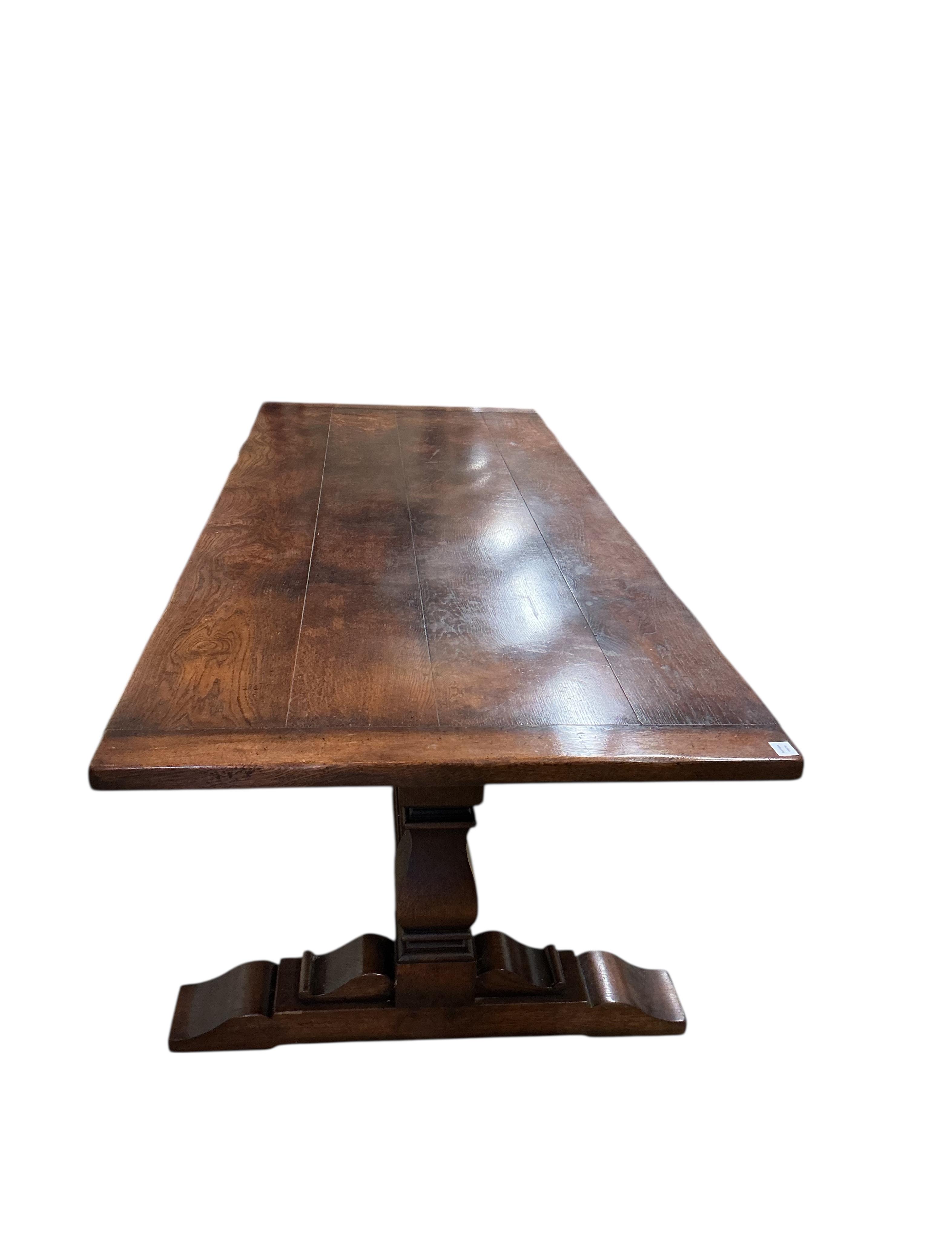 An 18th century style rectangular oak refectory dining table, width 274cm, depth 108cm, height 77cm